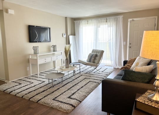 Living Room With TV at Aspire High Desert Apartments, Victorville, CA, 92392