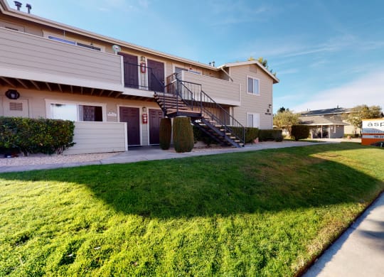 Exterior View of Apartment Building Surrounded By Lush Landscaping at Aspire High Desert Apartments, Victorville, 92392