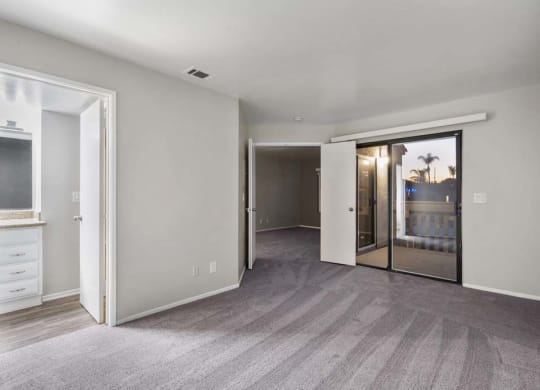 a bedroom with a bed and a mirror at Aspire Corona, Corona, CA