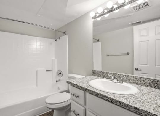 a bathroom with a sink toilet and bathtub at Aspire Corona, California, 92882