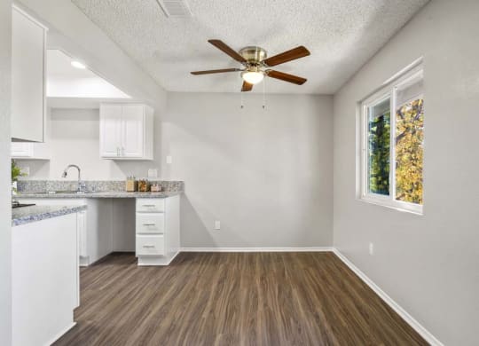 a kitchen with a ceiling fan and a window at Aspire Redlands, Redlands, CA
