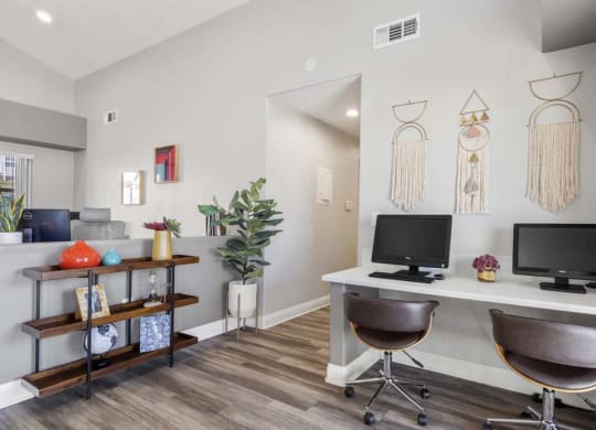 a room with a desk and two computer monitors at Aspire Redlands, California