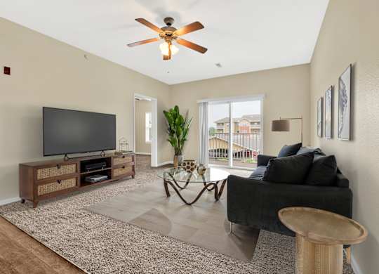 Living Area With Ceiling Fan at Deer Valley Apartments, Silvis, IL, 61282