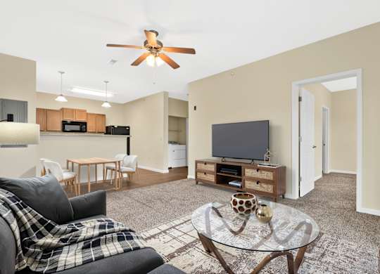 Living Room With TV at Deer Valley Apartments, Silvis, Illinois