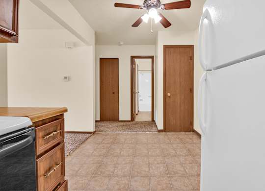 A kitchen with a refrigerator at Windsor Crest Apartments, Iowa, 52807