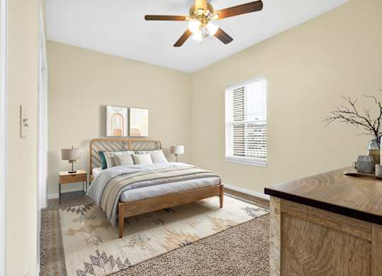 Bedroom With Ceiling Fan at Deer Valley Apartments, Silvis, IL