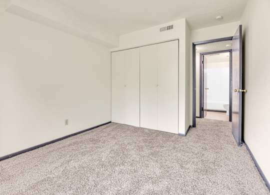 Carpeted Bedroom at Indian Ridge Apartments, Davenport, 52807