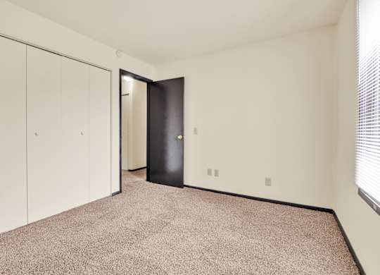 Bedroom With Closets at Indian Ridge Apartments, Iowa