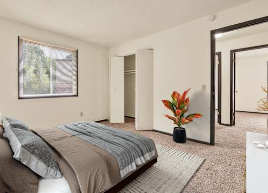 Comfortable Bedroom With Accessible Closet at Indian Ridge Apartments, Davenport, IA, 52807