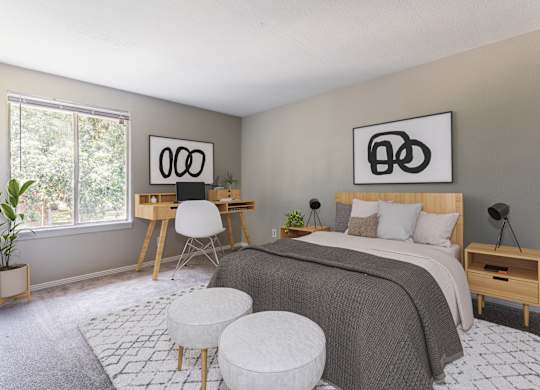 A bedroom with a bed, desk, and chair.