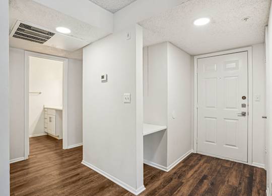 A white door is on the right side of the image.