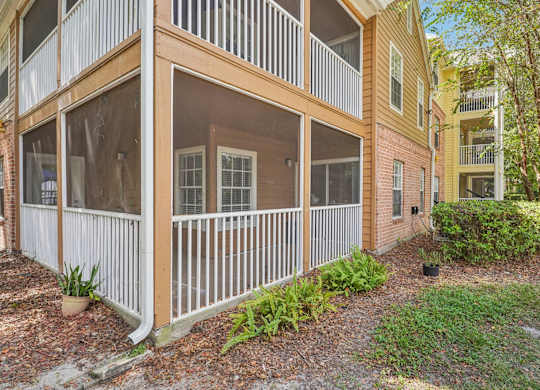 A building with a balcony and a white railing.
