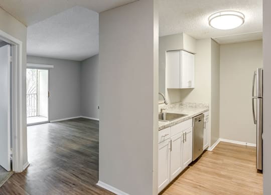 Living Room With Kitchen View at Newport Colony Apartment Homes, Florida, 32707