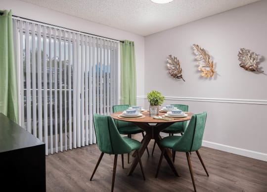 our apartments offer a dining room with a table and chairs  at The Park at Chesterfield Apartment Homes, Tampa, Florida
