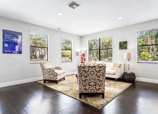 a living room with a couch and two chairs and windows at Waterford Park Apartment Homes, LLC, Lauderhill Florida