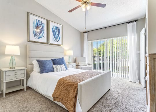 a bedroom with a bed and a ceiling fan at Waterford Park Apartment Homes, LLC, Lauderhill, FL 33319