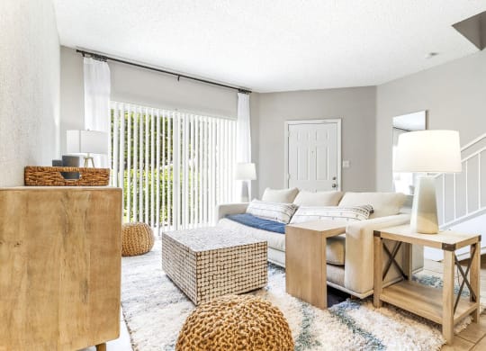 a living room with a couch and a table at Waterford Park Apartment Homes, LLC, Lauderhill Florida