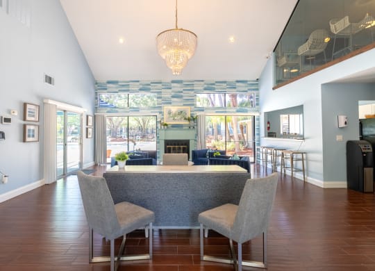 a dining room and living room with a table and chairs  at Fisherman's Landing Apartment Homes, Florida, 33637