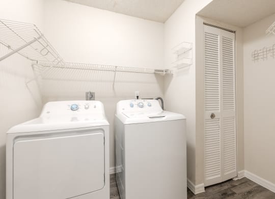a laundry room with two washes and a dryer  at Fisherman's Landing Apartment Homes, Tampa, FL, 33637