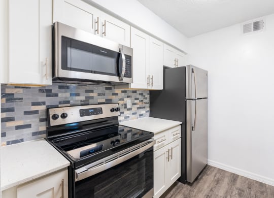 the preserve at ballantyne commons apartment kitchen with stainless steel appliances  at Fisherman's Landing Apartment Homes, Tampa, FL