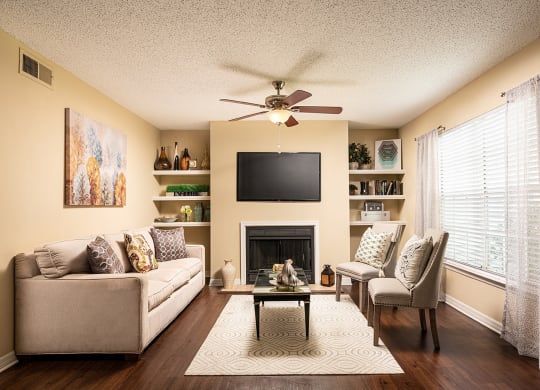 a living room with a ceiling fan and a television at Madison Oaks Apartment Homes, LLC, Palm Harbor, 34684