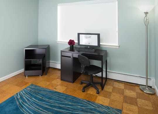 a home office with a desk and a computer at Raritan Crossing Apartment Homes, New Brunswick