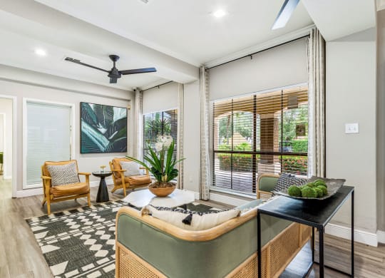 a living room with a couch and a table at Hidden Palms Apartment Homes, Tampa, 33613