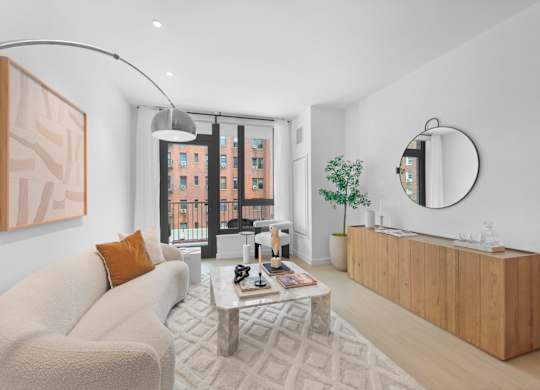 A modern living room with a large window and a view of a cityscape.