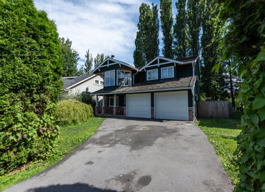 a house with a large driveway in front of it