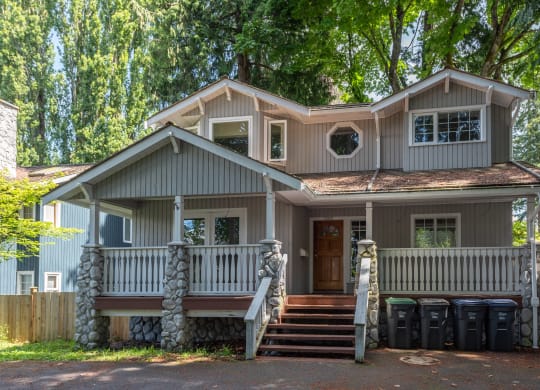 a house with a front porch and steps leading up to it
