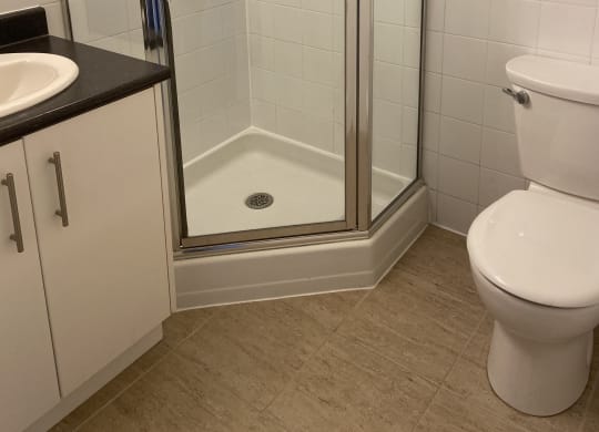 a small bathroom with a bathtub and a washer and dryer