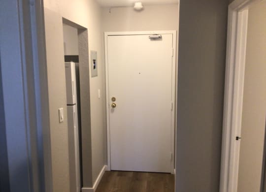 the door to the apartment is at the end of the hallway
