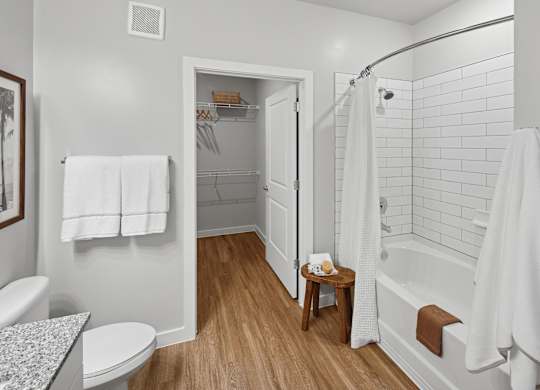 A white bathroom with a toilet, sink, and bathtub. at Allegra at Cocoa in Cocoa, FL, 32926