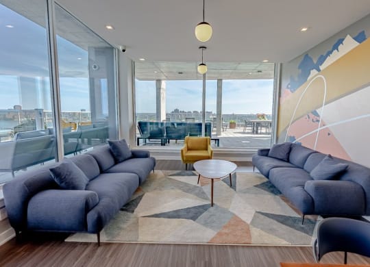 a living room with blue couches and a coffee table