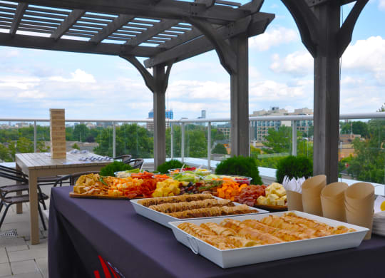 a buffet of food on a table on a roof