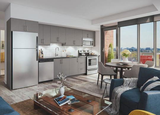 a kitchen and living room with stainless steel appliances
