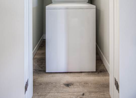 a washer and dryer in a small laundry room
