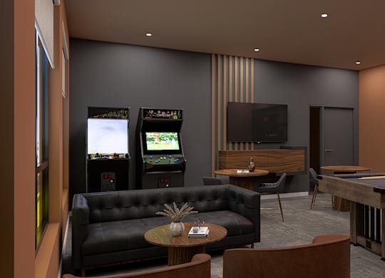 A room with a pool table, a couch, and a television.