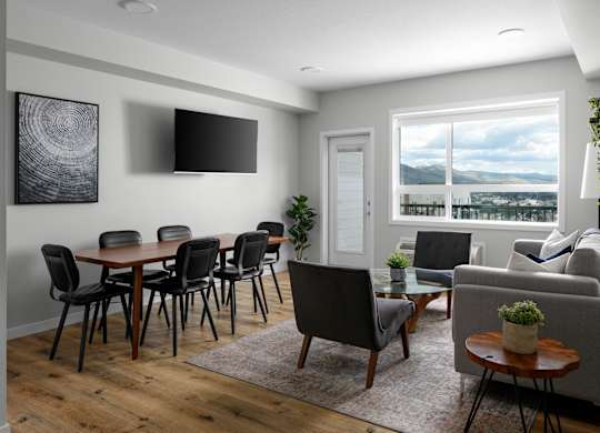 A modern living room with a wooden table and chairs.