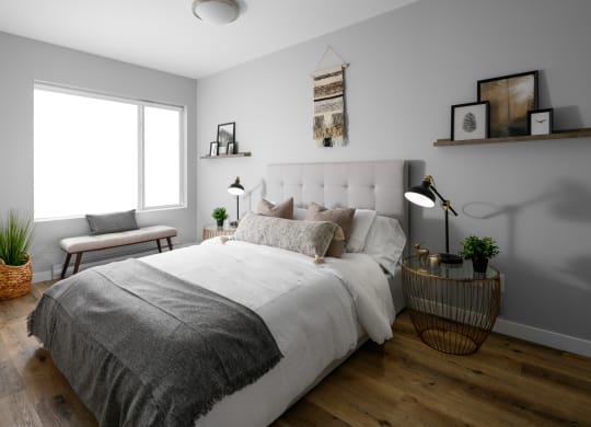 a bedroom with grey walls and a white bed