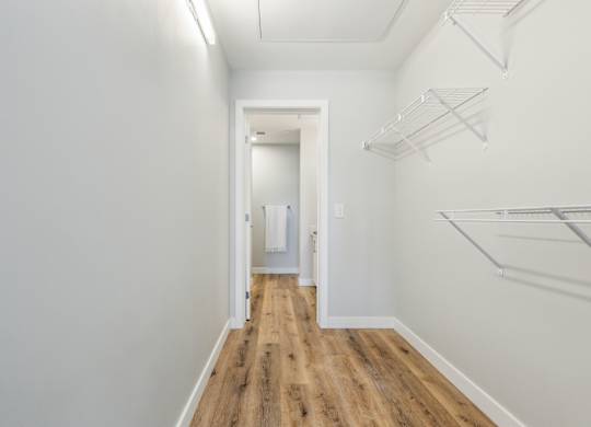 A long hallway with a door at the end.