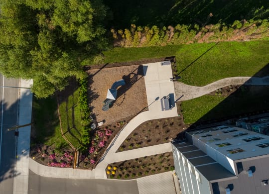 a birdseye view of a garden with a street sign on it