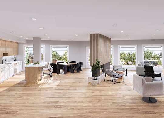 A modern living room with a dining area and kitchen in the background.