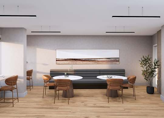 A modern living room with a grey sofa, wooden chairs, and a large painting on the wall.