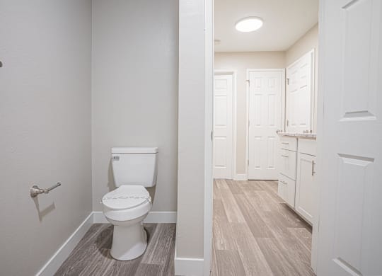 an empty bathroom with a toilet and a white closet at Regency Park, Nevada, 89509