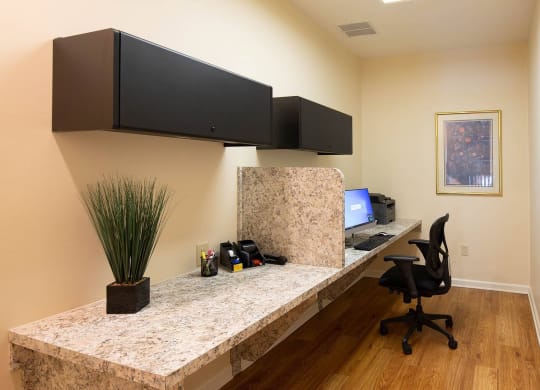 an office with a desk and a computer at Monroeville Apartments, Monroeville