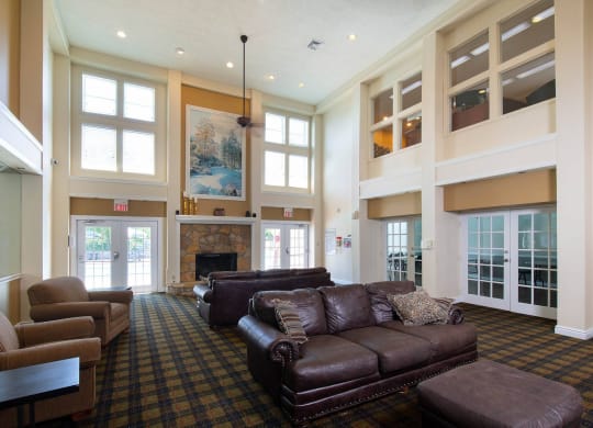a large living room with couches and chairs at Monroeville Apartments, Pennslyvania