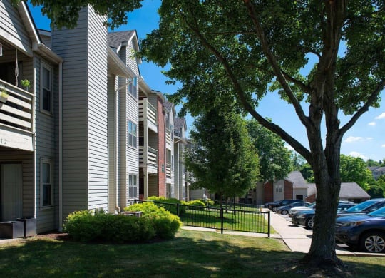 an apartment complex with a tree in the foreground at Monroeville Apartments, Monroeville, Pennslyvania