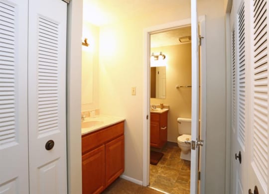 bathroom with a sink toilet and mirror at Monroeville Apartments, Pennslyvania, 15146