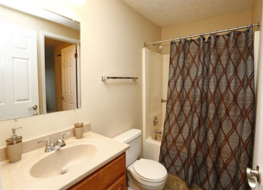 a bathroom with a sink toilet and shower at Monroeville Apartments, Monroeville, 15146